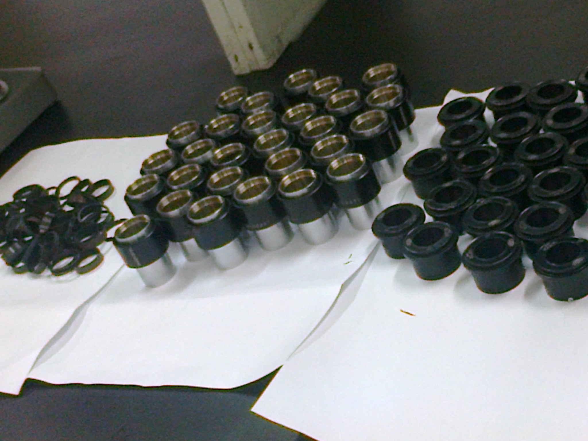 Microscope objective lenses being cleaned and restored