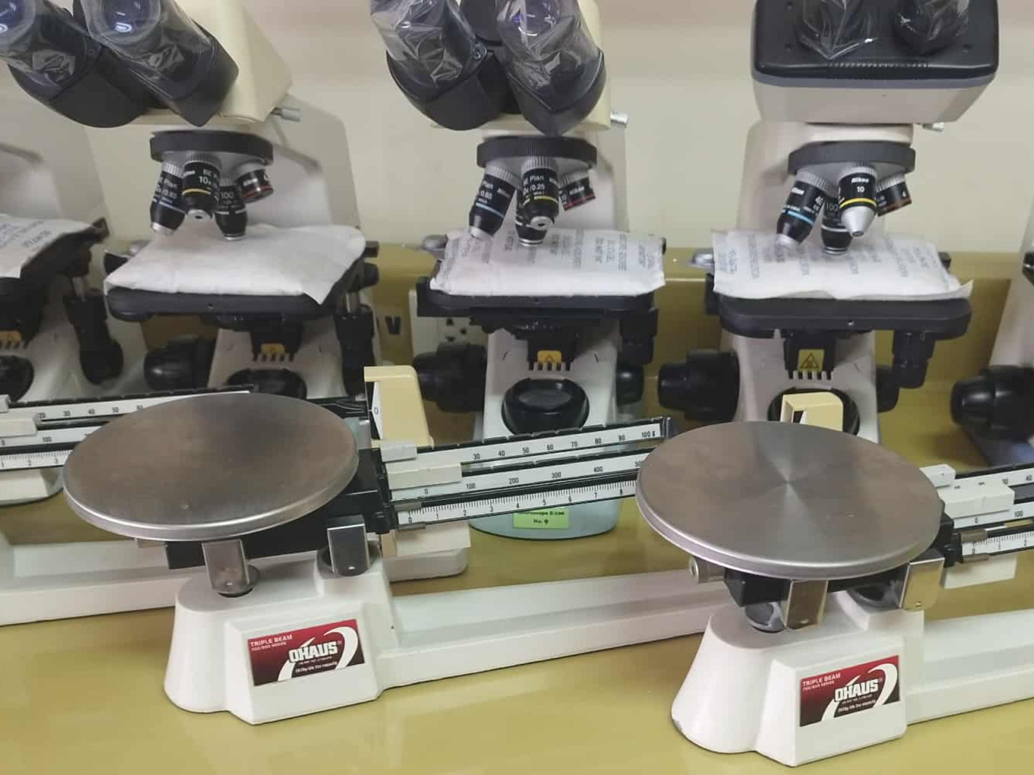 Restored microscopes and balances in laboratory